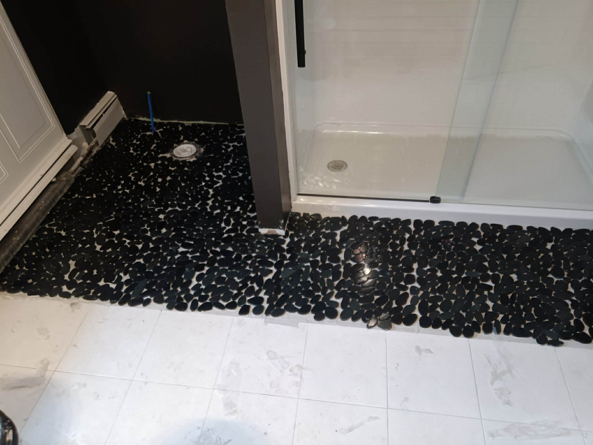 Bathroom renovation with custom tile work — professional remodel by Uncle Chal's